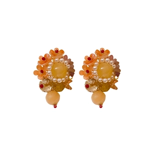 Elegant floral pendant earrings with colorful stones and pearls on a white background
