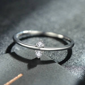 Minimalist S925 sterling silver ring featuring two claw-set round cubic zirconia stones