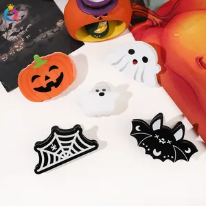 Variety of Halloween hair clips featuring bat, pumpkin, and ghost designs in a set