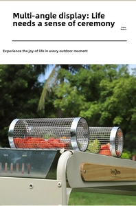 Detail of rolling stainless steel BBQ baskets in two sizes filled with fresh vegetables