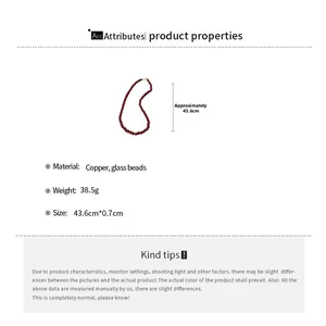 Detailed specs of the red glass bead necklace with copper accents, 43.6cm long