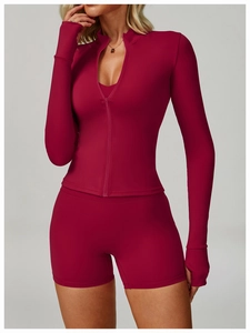 Detail of dark pink yoga jacket with thumbholes and breathable high-stretch sport fabric