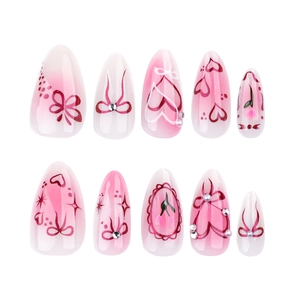 Pink gradient almond press-on nails with bow, heart, and cherry hand-painted designs