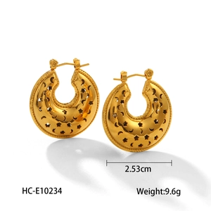Detailed view of hollow gold heart earrings with moon and star patterns, size 2.53cm