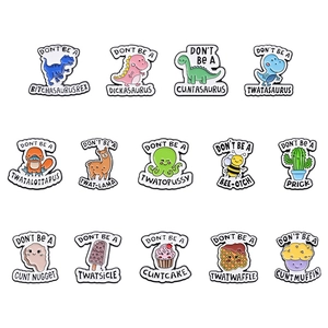 Set of 14 cartoon enamel pins featuring pink dinosaurs and animals on a white background