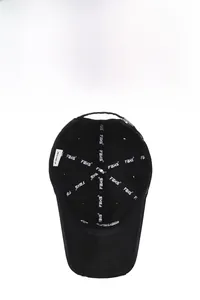 Detail view of the reinforced inner lining and brand logo on a black distressed baseball cap
