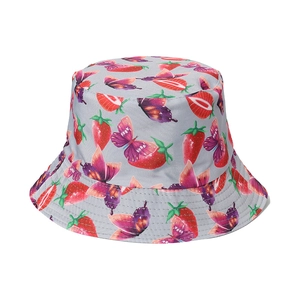 Detail shot of light grey sun hat with vibrant red strawberry and purple butterfly patterns