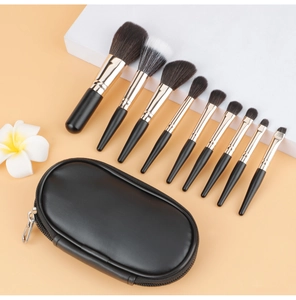 Detailed set of 10 professional makeup brushes with a sleek black portable leather case