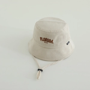 Detailed macro of cream corduroy bucket hat with Florida embroidery and adjustable wind string