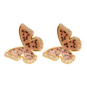 Polished gold butterfly earrings with leopard print enamel and sparkling cubic zirconia