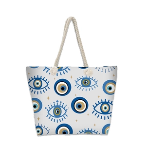 Detail of evil eye canvas beach bag showing large capacity and thick rope handles