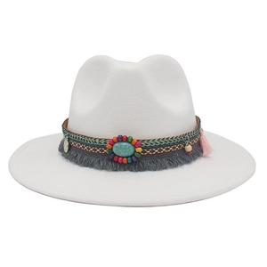 Detailed view of bohemian white wide-brim cowboy hat with turquoise beads and colorful tassels