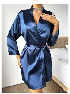 Detailed view of the dark blue satin robe showing high-gloss fabric and tied waist belt