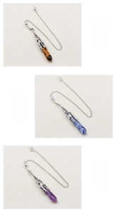 Three hexagonal crystal pendants in Tiger's Eye, Bluestone, and Amethyst with silver chains