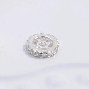 Macro view of S925 sterling silver wheel spacer bead with white cubic zirconia inlay