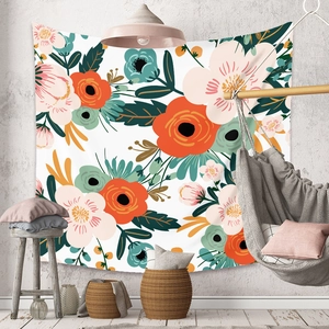 Floral wall tapestry featured in a cozy room with bohemian decor and woven furniture