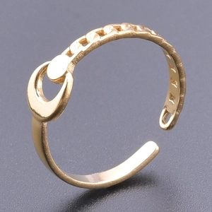 Detailed view of adjustable golden moon and chain ring on a dark matte background