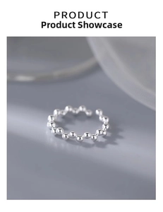 Macro view of adjustable S925 sterling silver beaded ring with minimalist geometric design