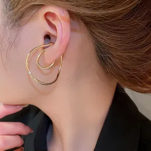 Minimalist golden irregular double-layered twisted ear cuff with non-pierced design