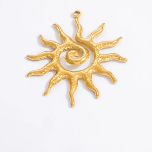 Detailed macro view of 18k gold plated sun-shaped pendant with hammered metal texture