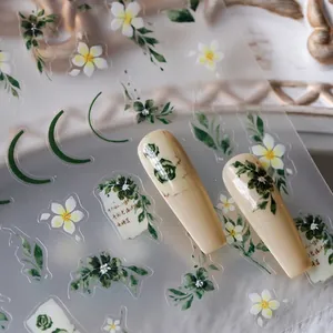 Embossed green leaf and white flower nail stickers with golden crescent moon patterns