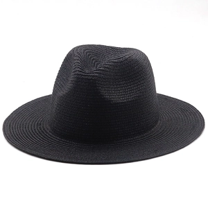 Close-up of black straw fedora hat showing fine weave texture and wide sunshade brim