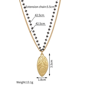 Double-layer 18K gold-plated stainless steel necklace with black beads and leaf pendant