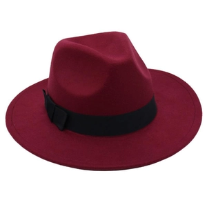 Detail of dark red wool fedora hat featuring classic black grosgrain ribbon and bow accent