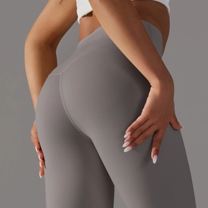 Detail view of high-waisted gray yoga leggings with V-shaped back stitching for butt lift