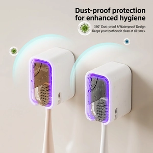 Wall-mounted dustproof toothbrush holder with UV sterilizer and protective cover