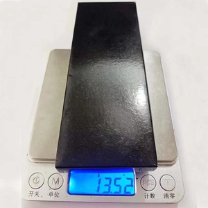 Digital scale showing the 13.52g weight of a black rectangular metal DIY keychain part