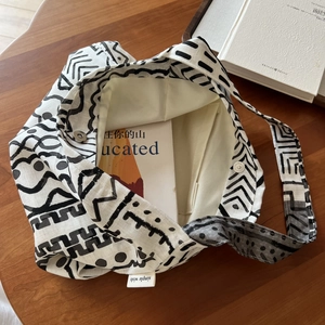 Detail of bohemian linen bag interior with magnetic snap closure and inner pockets