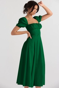 Detail view of high waist puff sleeve dress in dark green with square neck and tie waist