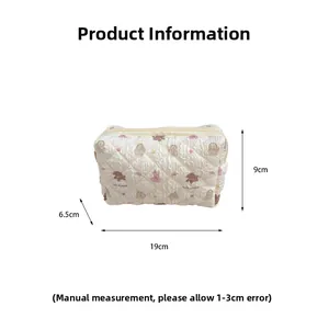 Quilted cosmetic bag with bear print showing 19cm x 9cm x 6.5cm dimensions on white background