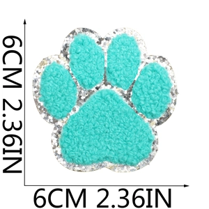 Detail of 6cm teal paw towel embroidery patch with shiny silver sequin border