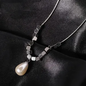 Titanium steel geometric cube necklace with hexagonal beads and drop pearl pendant
