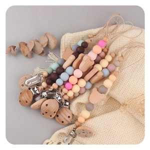Handmade beech wood and silicone baby pacifier clips featuring cute bear-shaped accents