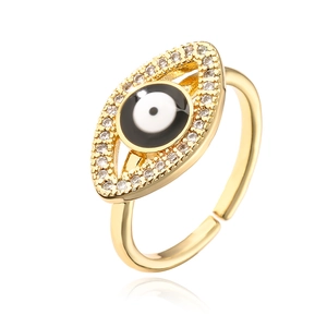 Macro shot of evil eye geometric ring featuring zircons and gold-plated adjustable band