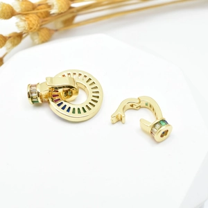 Golden round jewelry connector with colorful zircon stones shown in open and closed views