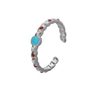 Detail of adjustable stainless steel ring with blue stone and colorful enamel dots