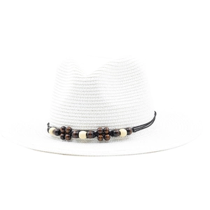 Close-up of white woven Panama hat with wooden beads and black rope decorative band