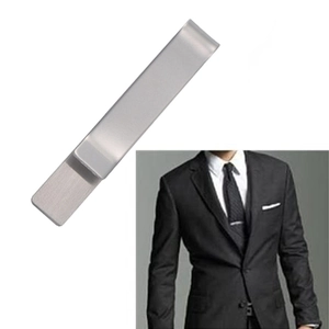 Polished silver tie clip for men with a minimalist design shown on a classic suit