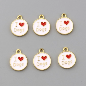 Close-up of golden round I Love Dogs charms with white enamel and red heart accents