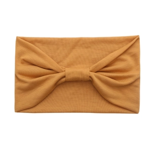 Wide yellow cotton sports headband with bow knot for yoga and fashion styling