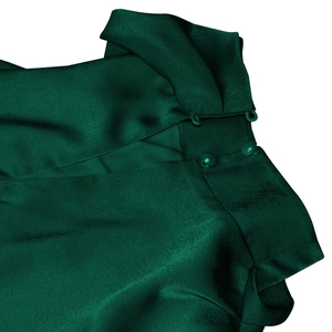 Detail view of green satin dress neck with elegant buttons and cutout shoulder design