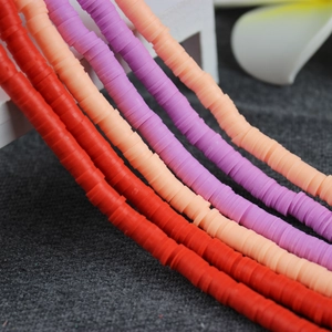 Close-up of vibrant 4mm 6mm colorful polymer clay spacer beads for DIY jewelry making