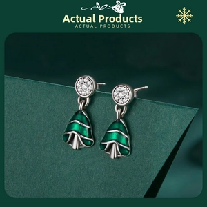 Detailed view of s925 silver Christmas tree earrings with green enamel and zircon stones