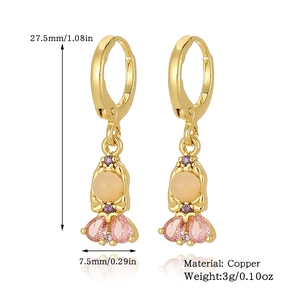 Detail view of girl pendant earrings in copper with pink zircon and dimensions 27.5x7.5mm