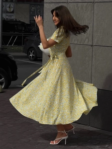 Bohemian floral wrap maxi dress with V-neckline and waist tie closure in sunny yellow