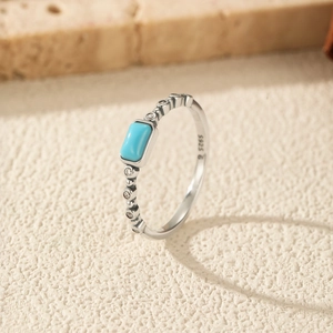 Elegant S925 sterling silver ring with blue turquoise stone and side zircon accents